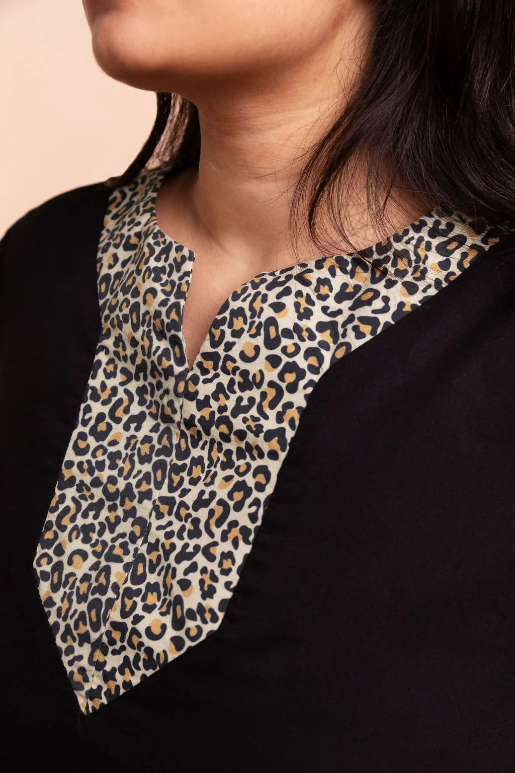 MAYA - Black dip hem dress with a touch of animal print