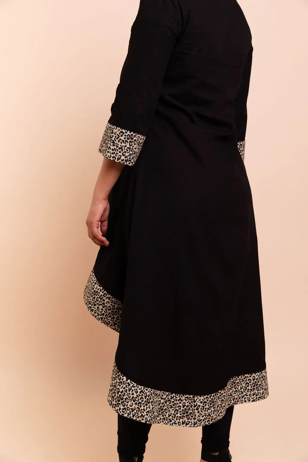 MAYA - Black dip hem dress with a touch of animal print