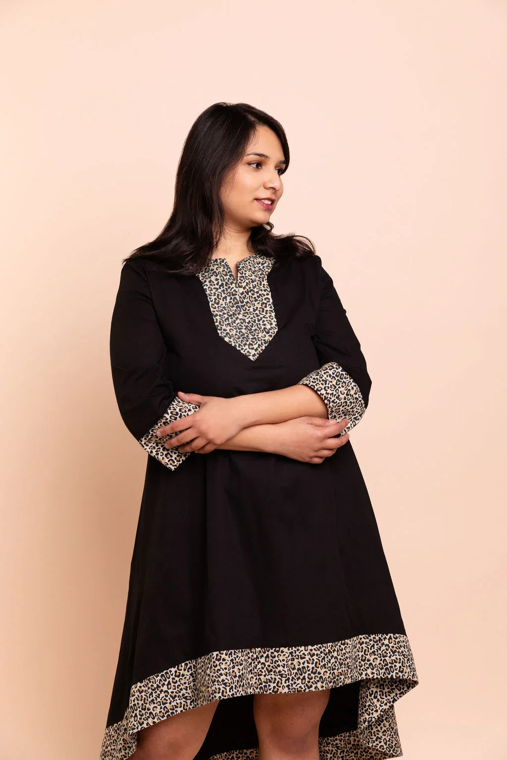 MAYA - Black dip hem dress with a touch of animal print