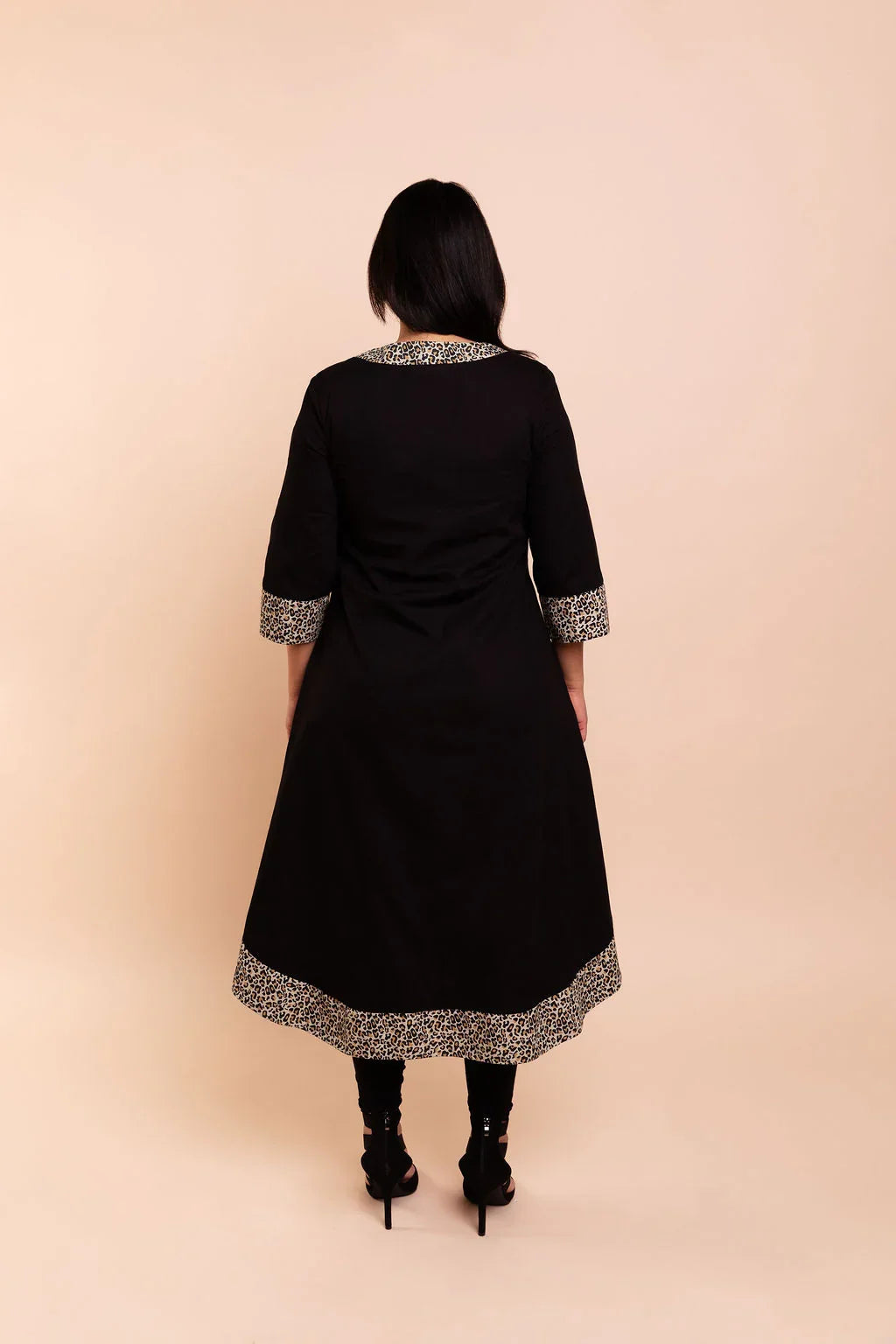 MAYA - Black dip hem dress with a touch of animal print