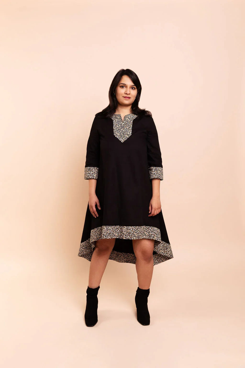 MAYA - Black dip hem dress with a touch of animal print