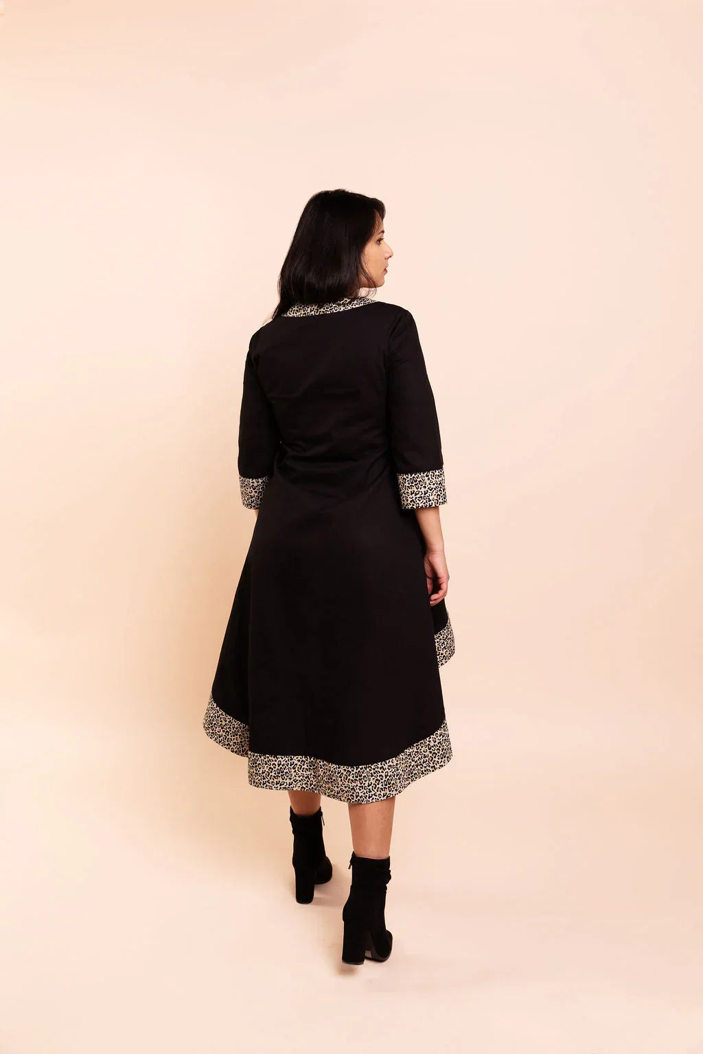 MAYA - Black dip hem dress with a touch of animal print