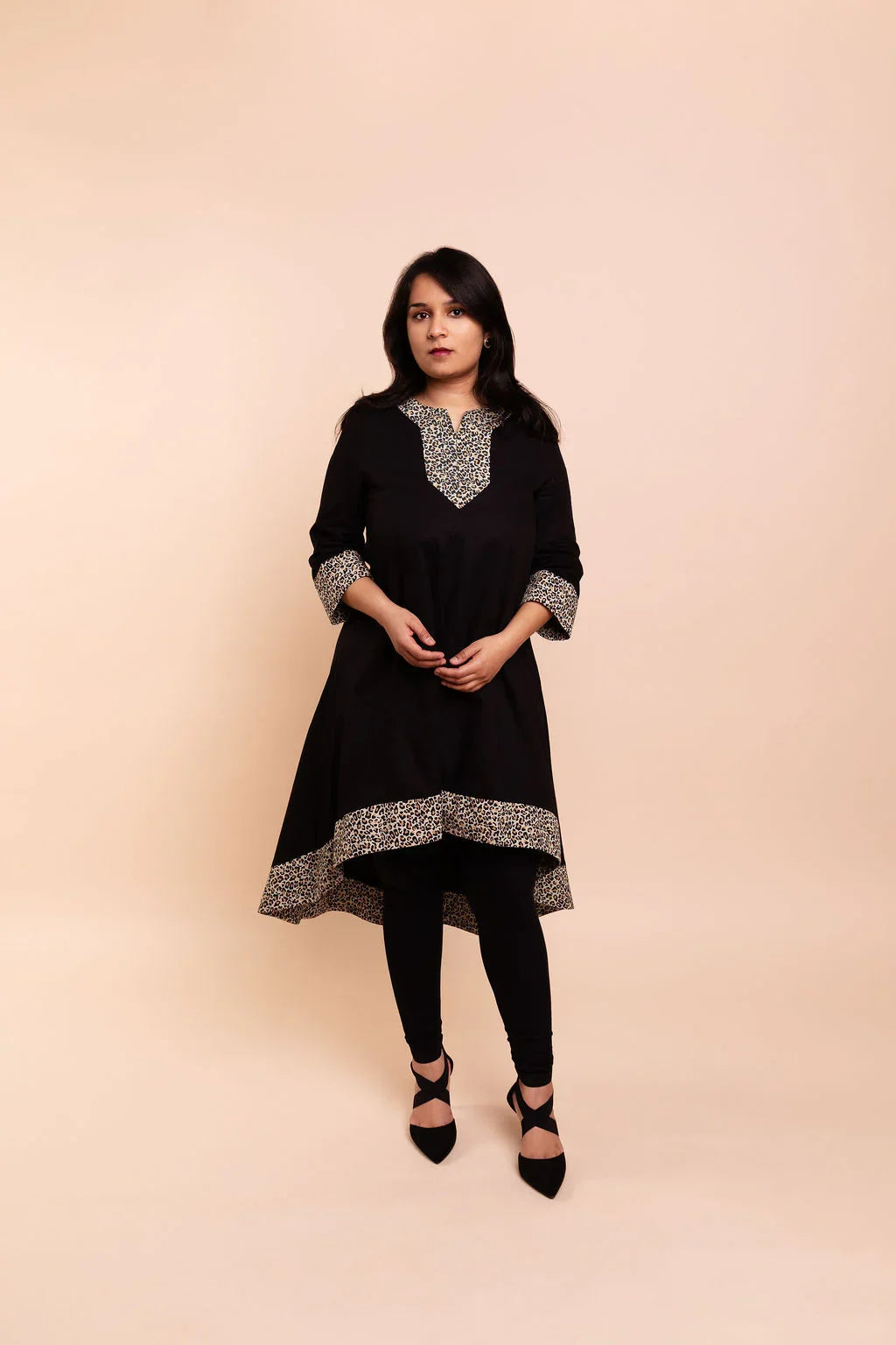 MAYA - Black dip hem dress with a touch of animal print
