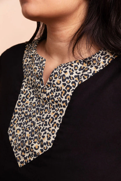 MAYA - Black dip hem dress with a touch of animal print