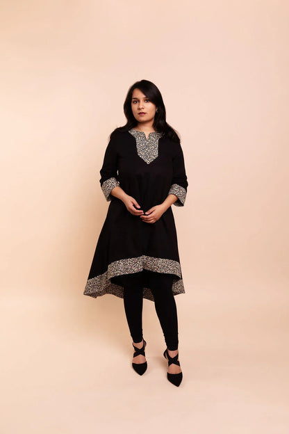 MAYA - Black dip hem dress with a touch of animal print