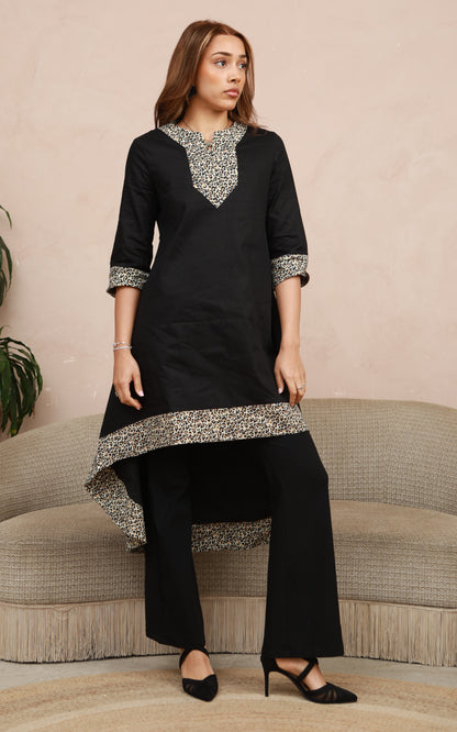 MAYA - Black dip hem dress with a touch of animal print